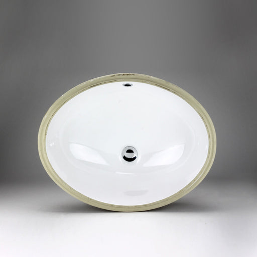 White oval Acritec undermount ceramic basin with sloped sides beneath a premium countertop surface