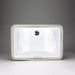 White rectangular Acritec undermount ceramic basin with curved bottom installed under a unique countertop