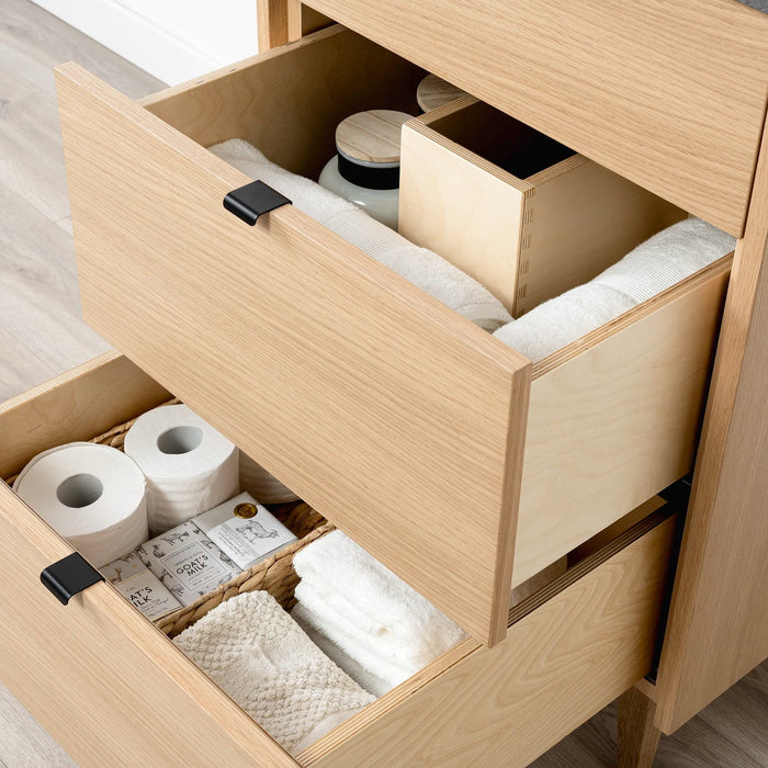 Ashbury 24" White Oak Vanity – top drawer interior with Concrete Grey quartz top and black pulls.