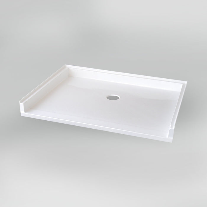 White Acritec barrier free single threshold shower base with center drain and ultra-low profile in an accessible bathroom