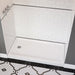 Overhead view of versatile Acritec single threshold end drain shower pan in a renovated bathroom setup