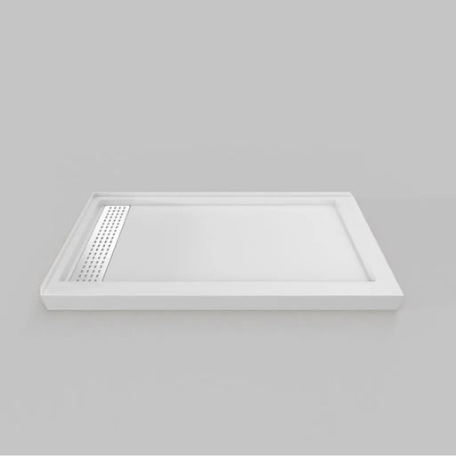 White Acritec linear end drain low profile double threshold shower base with LH stainless grill in an industrial bathroom