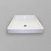 White Acritec regular profile single threshold shower base with end drain in a standard alcove shower setup